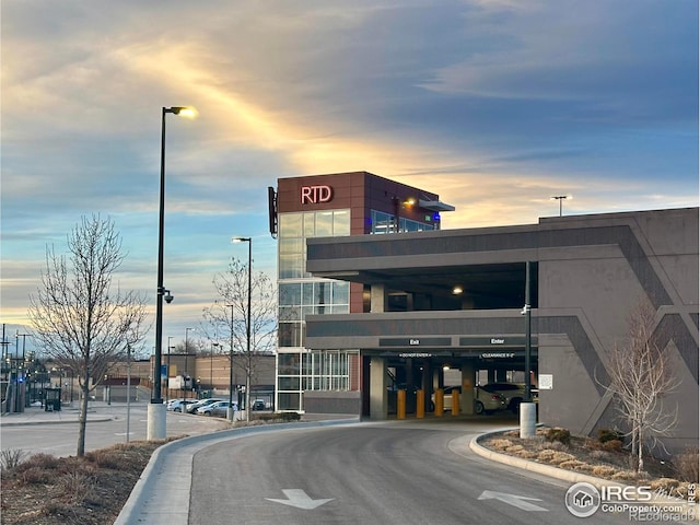 view of outdoor building at dusk