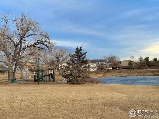 surrounding community featuring a lawn and a playground