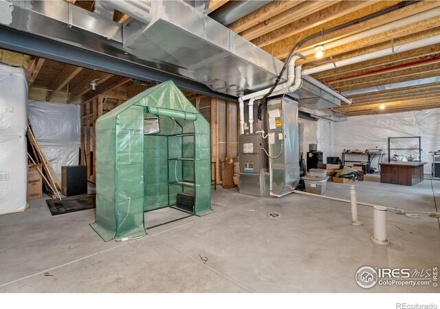 basement featuring heating unit