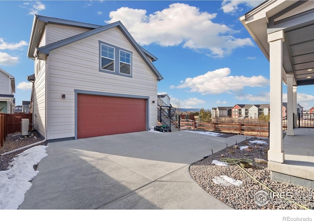 view of side of property featuring a garage