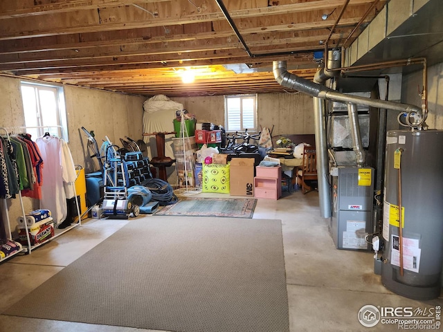 basement featuring heating unit and gas water heater