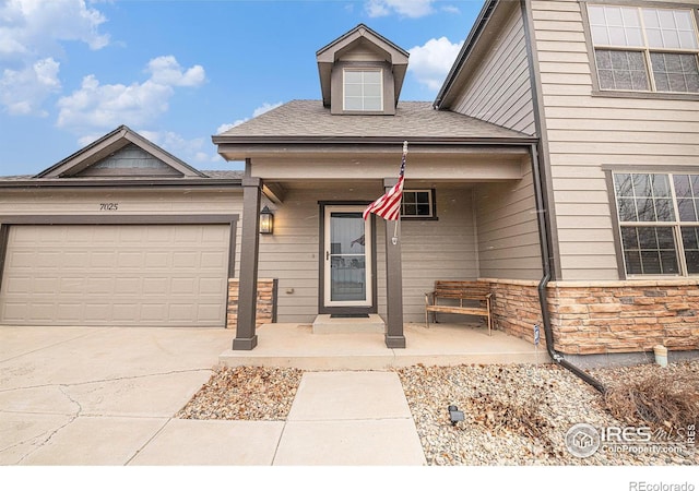 view of front of house featuring a garage and covered porch