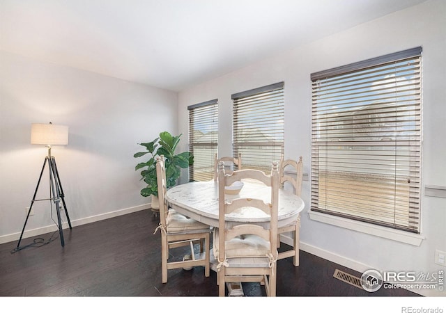 dining room featuring dark hardwood / wood-style flooring