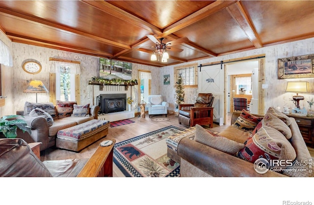 2420 Big Owl Rd, Allenspark, CO 80510 - living room with coffered ceiling, wood ceiling, hardwood / wood-style flooring, ceiling fan, and a barn door