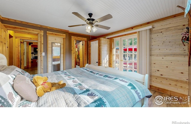 2420 Big Owl Rd, Allenspark, CO 80510 - bedroom with french doors, ceiling fan, and wood walls