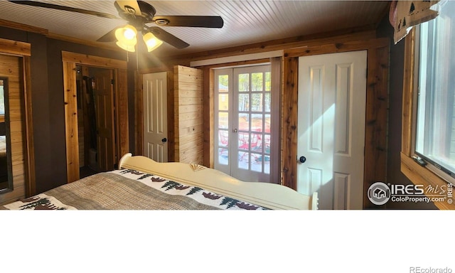 2420 Big Owl Rd, Allenspark, CO 80510 - bedroom with french doors, ceiling fan, and wooden walls