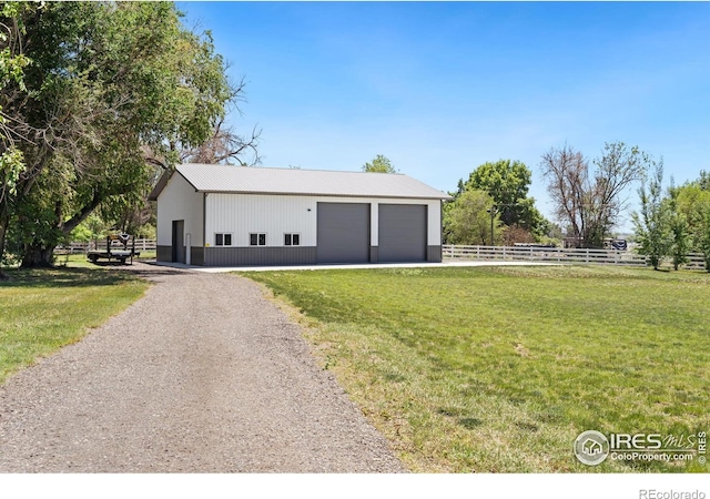 garage featuring a yard