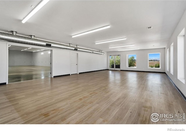 unfurnished room featuring hardwood / wood-style floors