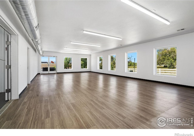 empty room featuring dark wood-type flooring