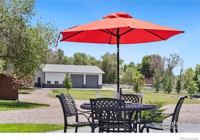 view of patio / terrace featuring an outbuilding and a garage