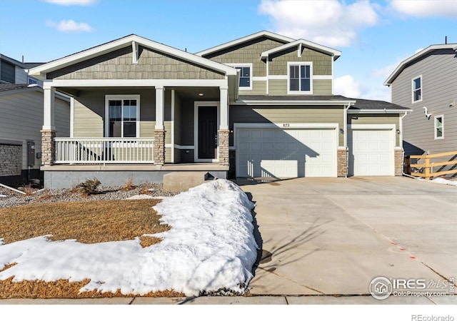 craftsman house featuring a garage and covered porch