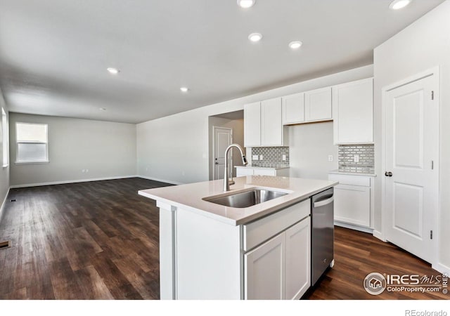 kitchen with white cabinetry, an island with sink, sink, and stainless steel dishwasher