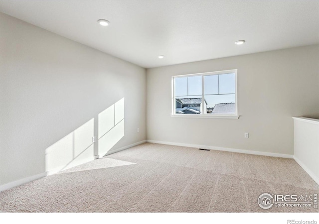 view of carpeted spare room