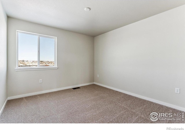 view of carpeted spare room