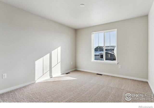 view of carpeted spare room