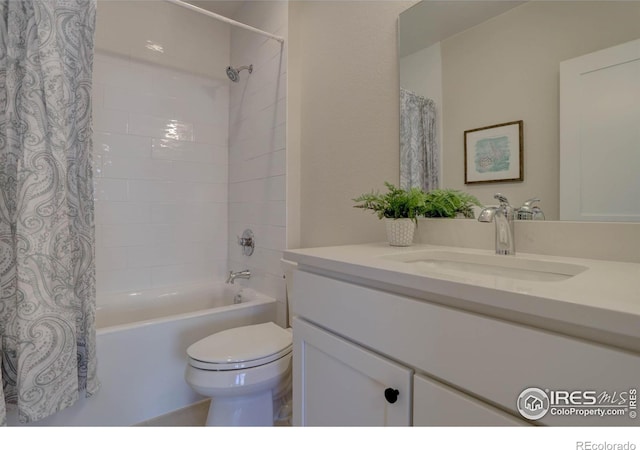 full bathroom featuring shower / bathtub combination with curtain, vanity, and toilet