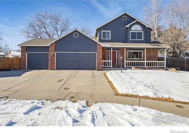 view of front of house featuring a garage and covered porch