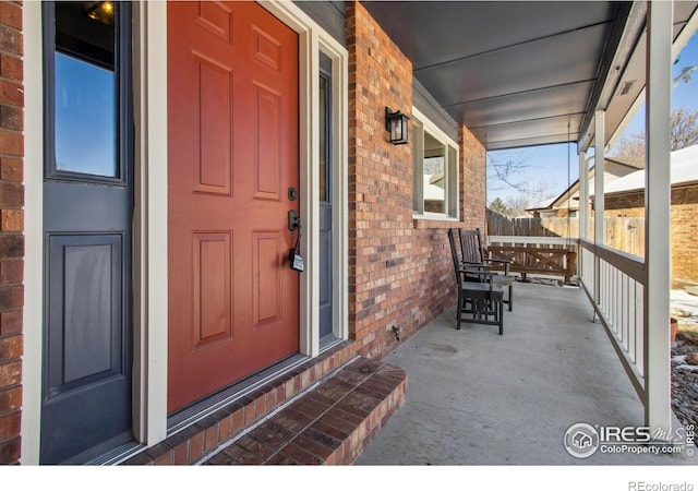 entrance to property featuring covered porch