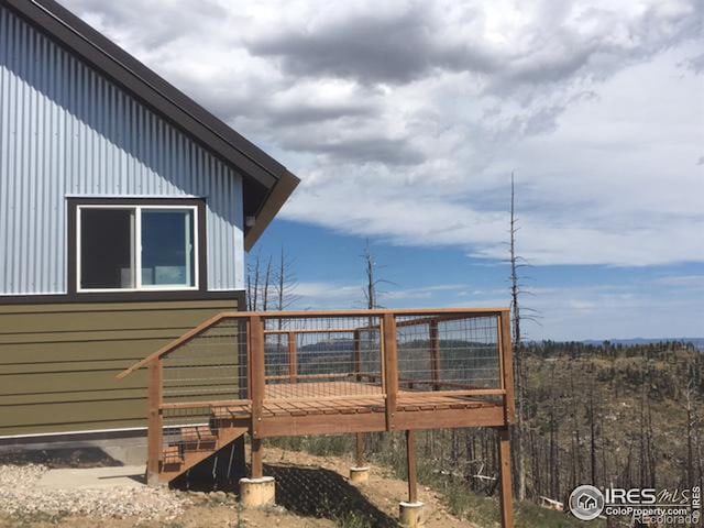 view of side of home with a deck