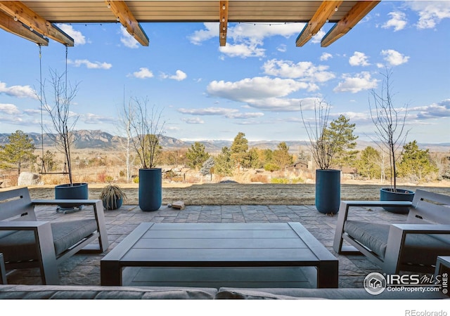 view of patio featuring a mountain view