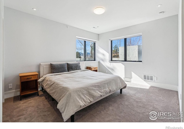 carpeted bedroom featuring recessed lighting, visible vents, and baseboards