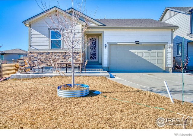 ranch-style house featuring driveway and an attached garage