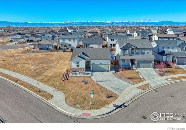 birds eye view of property featuring a residential view and a mountain view