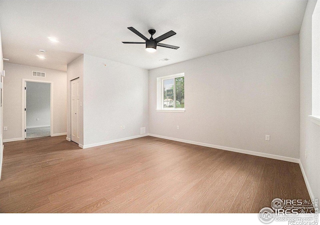 unfurnished room with hardwood / wood-style floors and ceiling fan