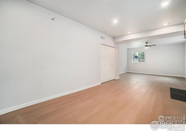 unfurnished room featuring ceiling fan and light wood-type flooring