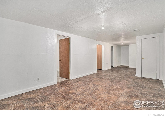 basement with a textured ceiling