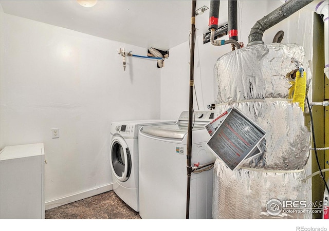 clothes washing area featuring washer and dryer