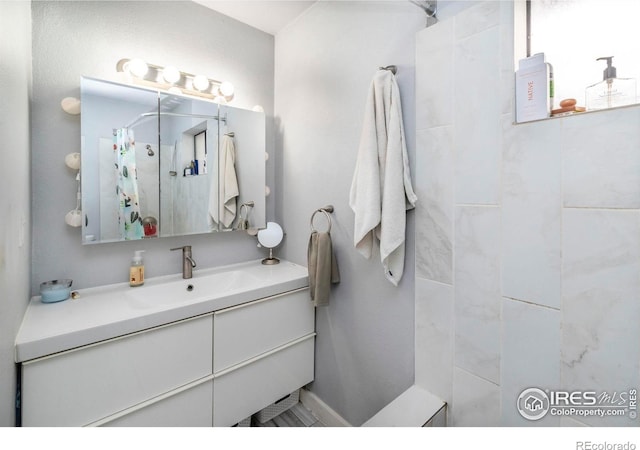 bathroom with vanity and a shower with shower curtain