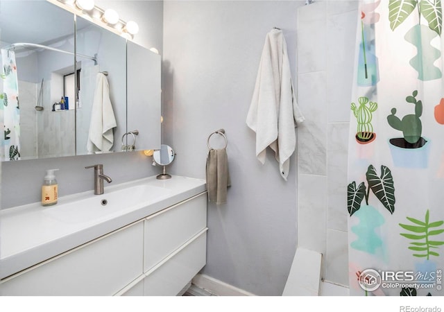 bathroom with vanity and a shower with shower curtain