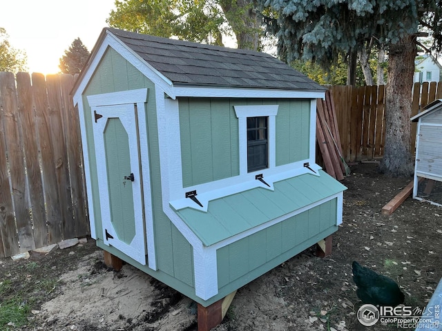 view of shed featuring a fenced backyard