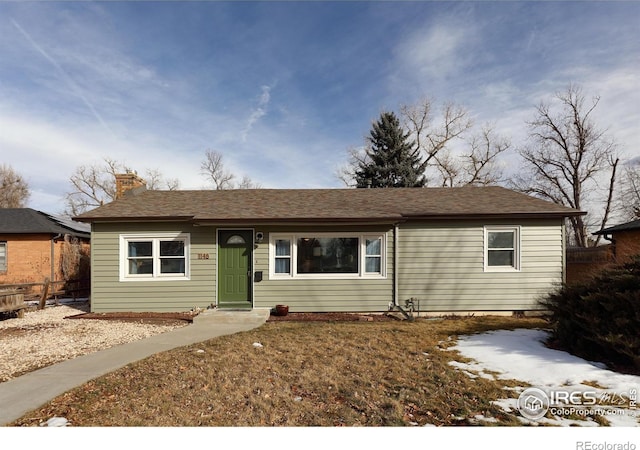 ranch-style home with fence and a chimney