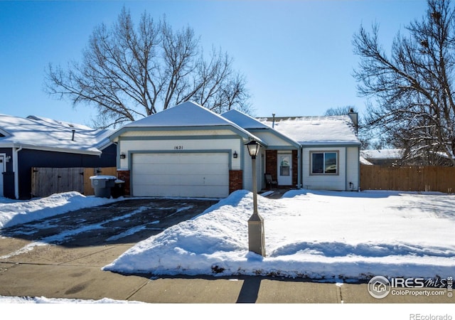 single story home featuring a garage