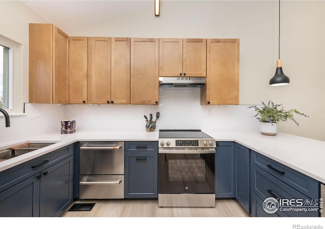 kitchen with under cabinet range hood, a sink, light countertops, stainless steel electric range oven, and vaulted ceiling