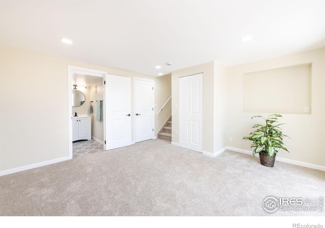 interior space featuring recessed lighting, stairway, and baseboards