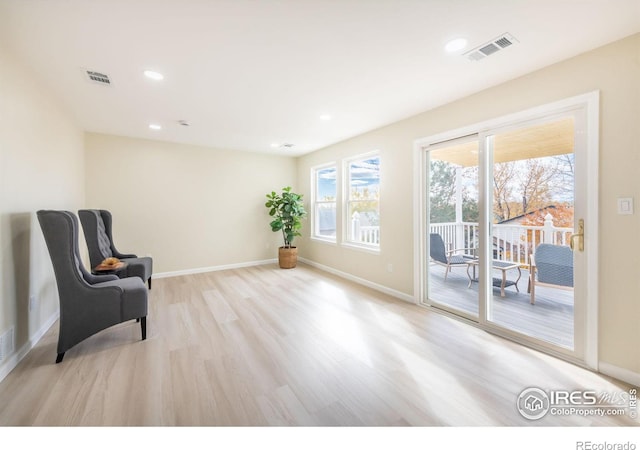 sitting room featuring recessed lighting, visible vents, baseboards, and wood finished floors