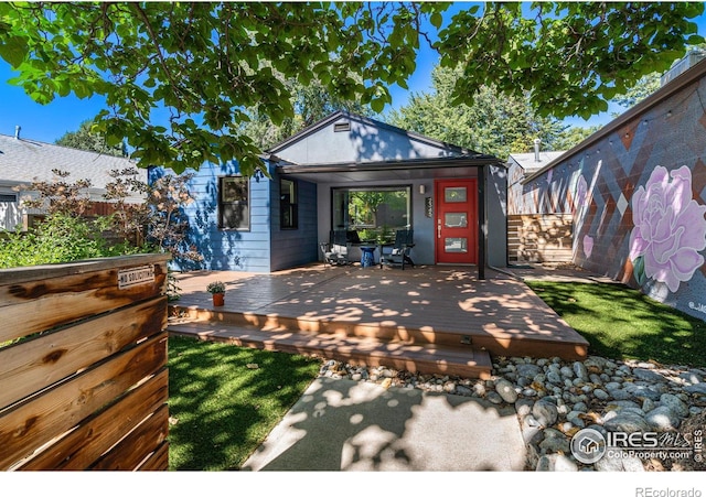 exterior space with an outbuilding and a deck