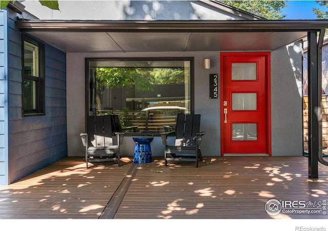 doorway to property featuring a deck