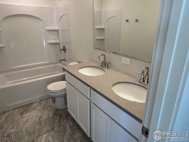 full bathroom featuring vanity, bathtub / shower combination, and toilet