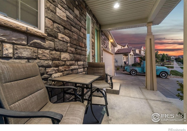 patio terrace at dusk with a garage