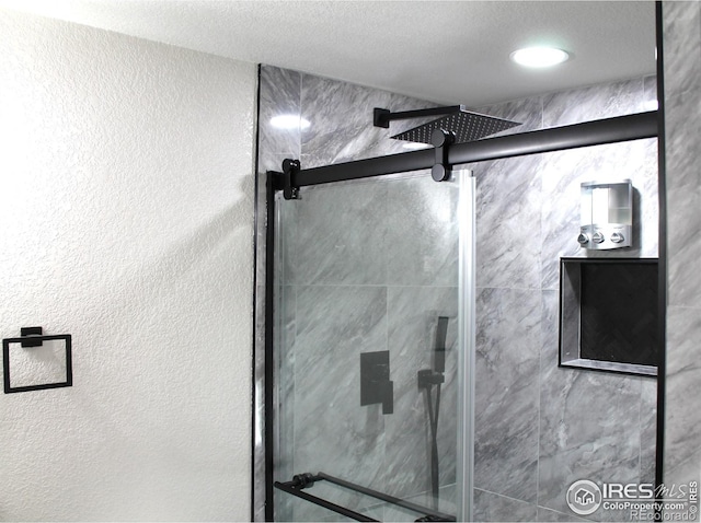 bathroom with an enclosed shower