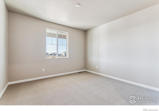 view of carpeted spare room