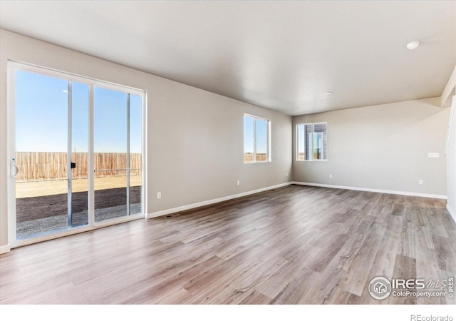 spare room with light wood-type flooring