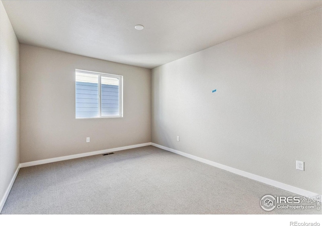 spare room with carpet floors