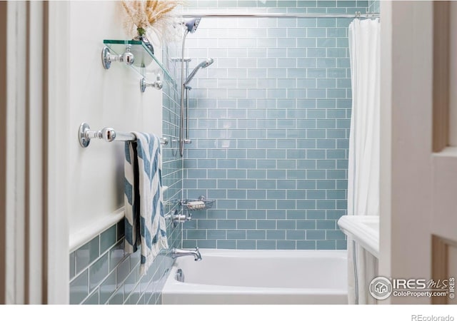 bathroom with shower / tub combo