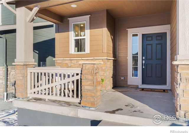 doorway to property with a porch