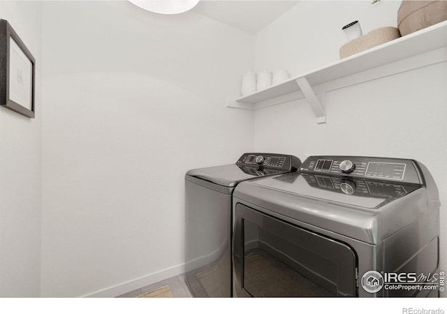 laundry room featuring washer and clothes dryer